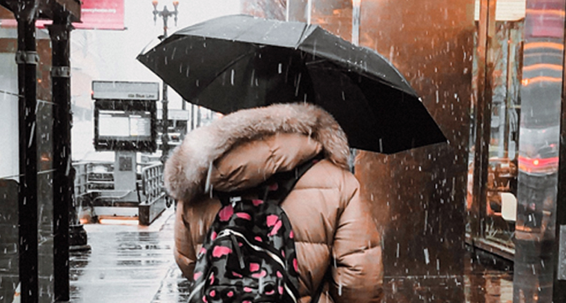 Rain storm, person with umbrella